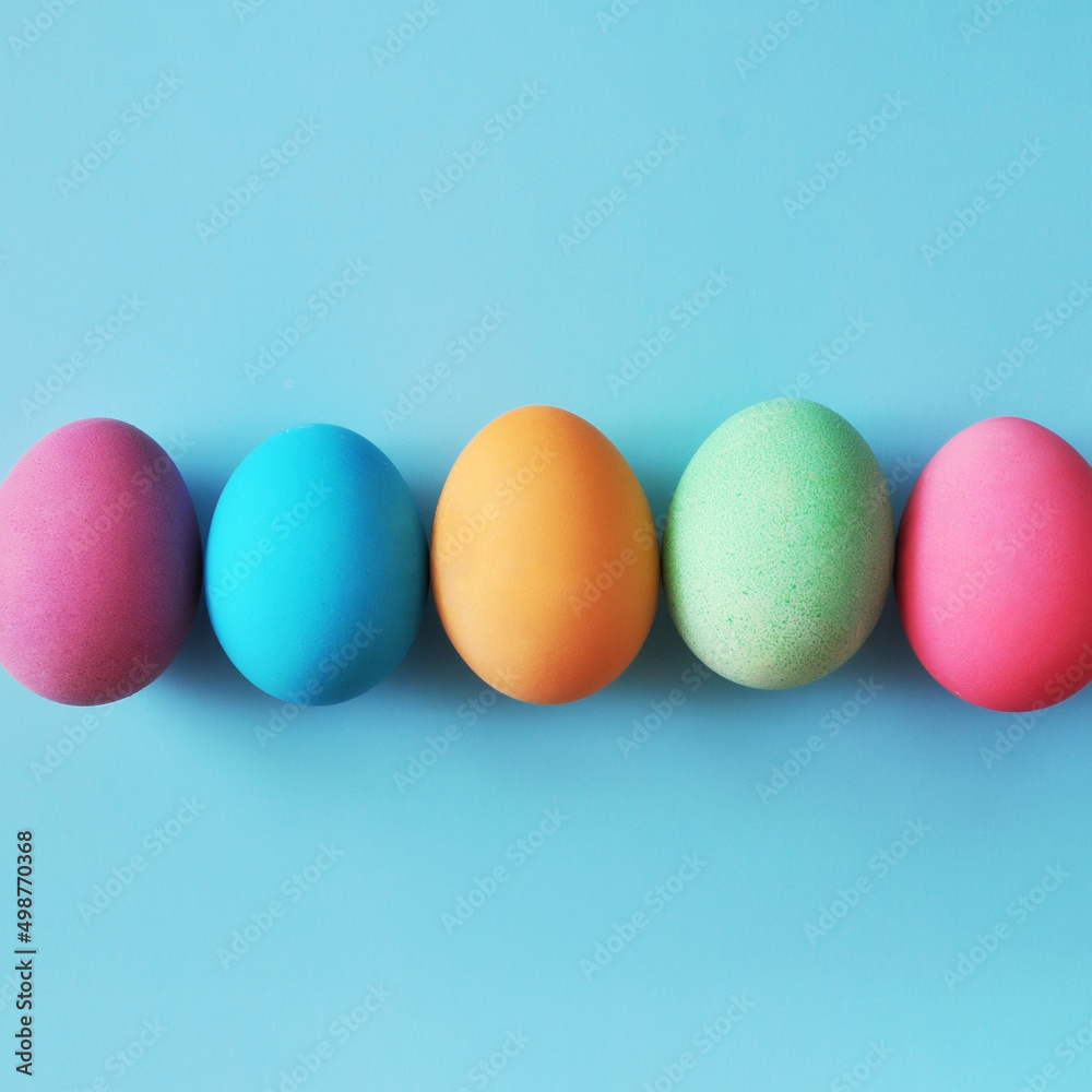 Preparation for the Easter holiday. Eggs and Easter decor on a bright background.