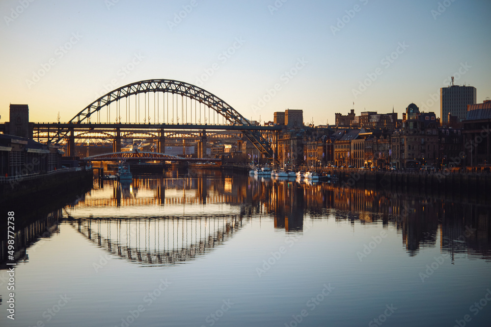 Fototapeta premium Newcastle upon Tyne/UK - 31st Dec 2019: Still river tyne at dusk on a winters day 