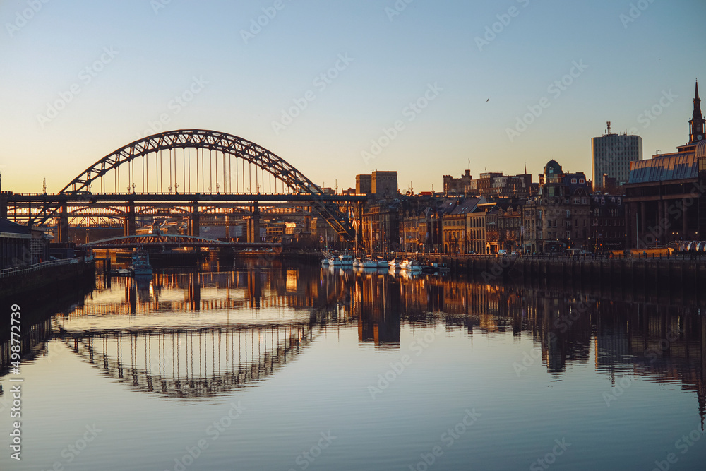 Naklejka premium Newcastle upon Tyne/UK - 31st Dec 2019: Still river tyne at dusk on a winters day 