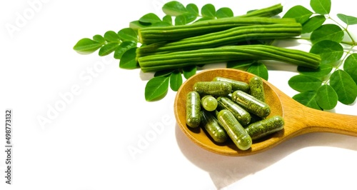 dry herbal capsule on hand isolated on white