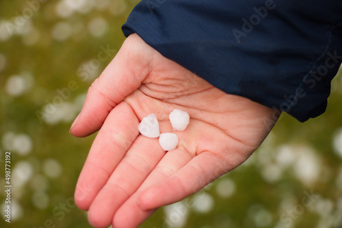 person holding hale stones