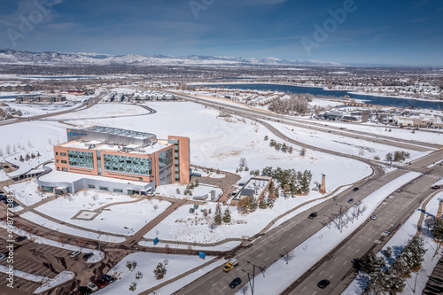 Aerial view of Highlands Ranch commercial buildings skyline in Colorado during after snow storm
