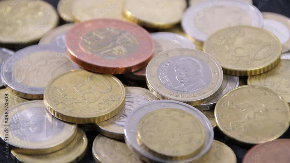 Coins on a black cloth close-up, the concept of business plans, investments or savings Coins on a black cloth close-up, the concept of business plans, investments or savings