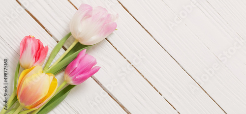 Fototapeta Naklejka Na Ścianę i Meble -  beautiful tulips on white wooden background