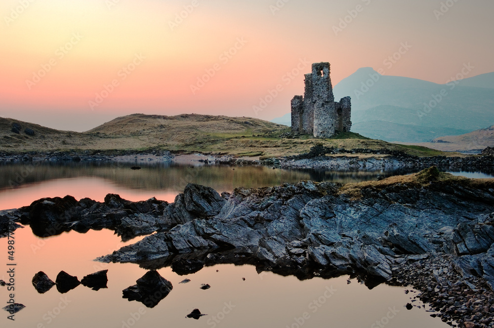 Ardvreck Castle on the shore of Loch Assynt, north west Highlands, Scotland, dates from 15th C. Quinag mountain behind