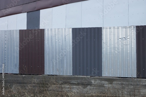 Wallpaper Mural part gray white metal fence wall on a concrete foundation outdoors Torontodigital.ca