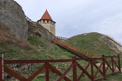 Ancient fortress of the port city, stone walls, isolated knight elements photo