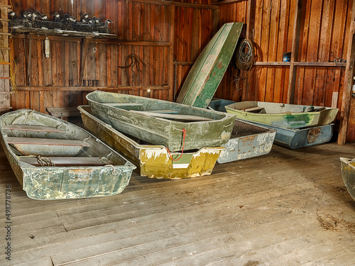 Fotografiet Row Boats In A Boathouse