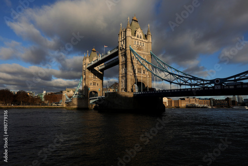 London view with the most iconic symbol of London, Tower Bridge illuminated by the last rays of the sun before sunset. photo