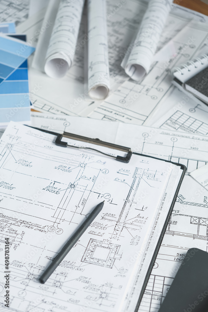 Architects concept, engineer architect designer freelance work on start-up project drawing, construction plan. architect design working drawing sketch plans blueprints and making construction model
