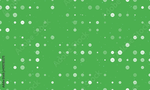 Seamless background pattern of evenly spaced white depression symbols of different sizes and opacity. Vector illustration on green background with stars