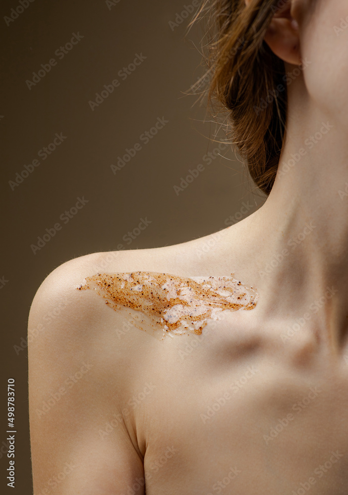 Cosmetic scrub on delicate skin. Self care at home. Salon procedure. Skin cleansing. Body scrub close-up
