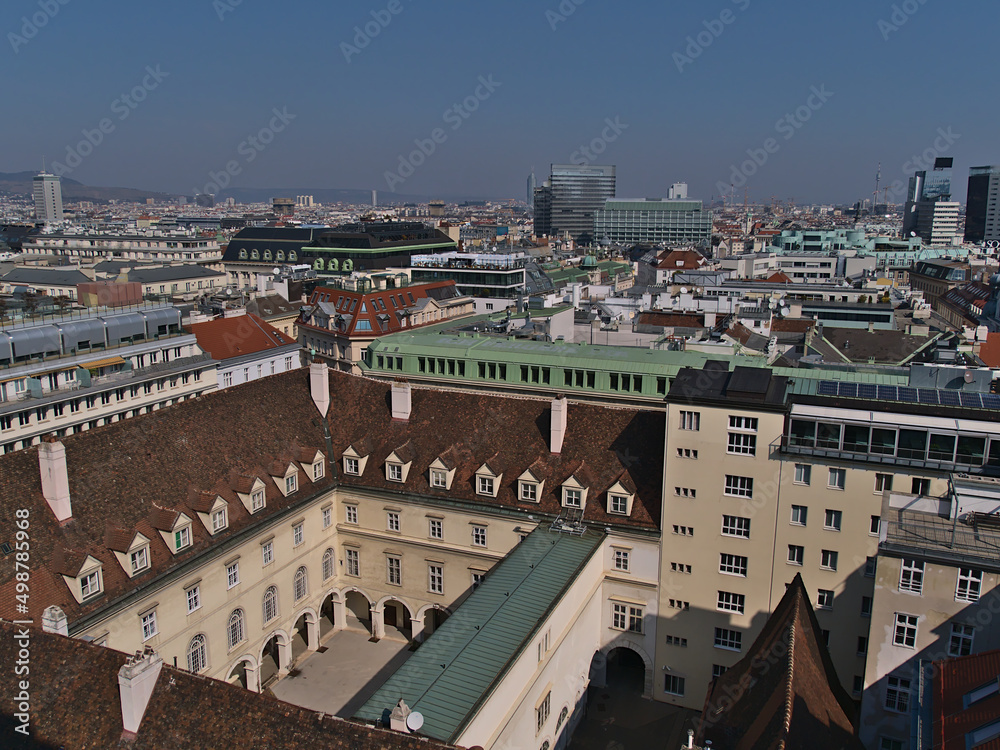 Beautiful aerial panoramic view of the historic downtown of Vienna, Austria with old buildings and skyscrapers on sunny day in early spring.