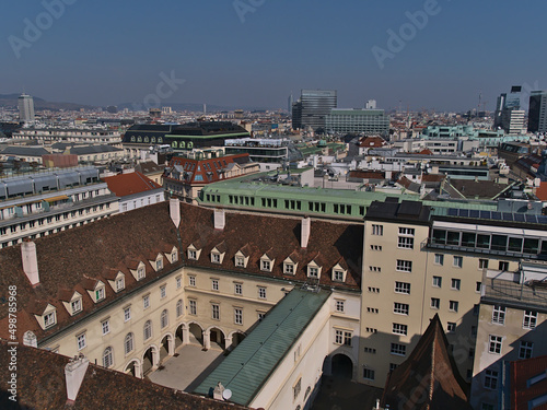Beautiful aerial panoramic view of the historic downtown of Vienna, Austria with old buildings and skyscrapers on sunny day in early spring. © Timon