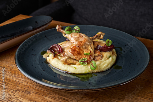 Restaurant Food - Farm chicken with mashed potatoes and bacon on a plate