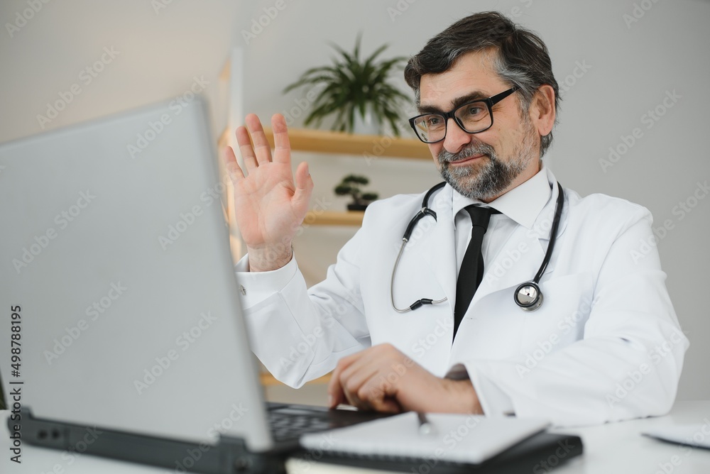 Doctor consulting patient using video chat in clinic, view from web camera. Doctor consulting patient using video chat in clinic, view from web camera.