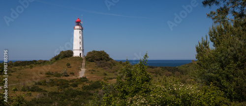 Panoramic view to the beautiful Hiddensee lighthouse on the laid bay island of Hiddensee.