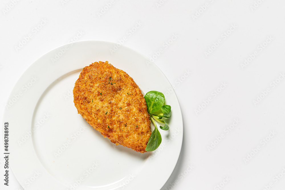 chicken cutlet on the white plate chicken cutlet on the white plate