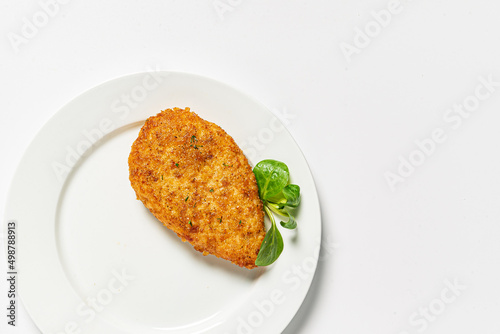 chicken cutlet on the white plate