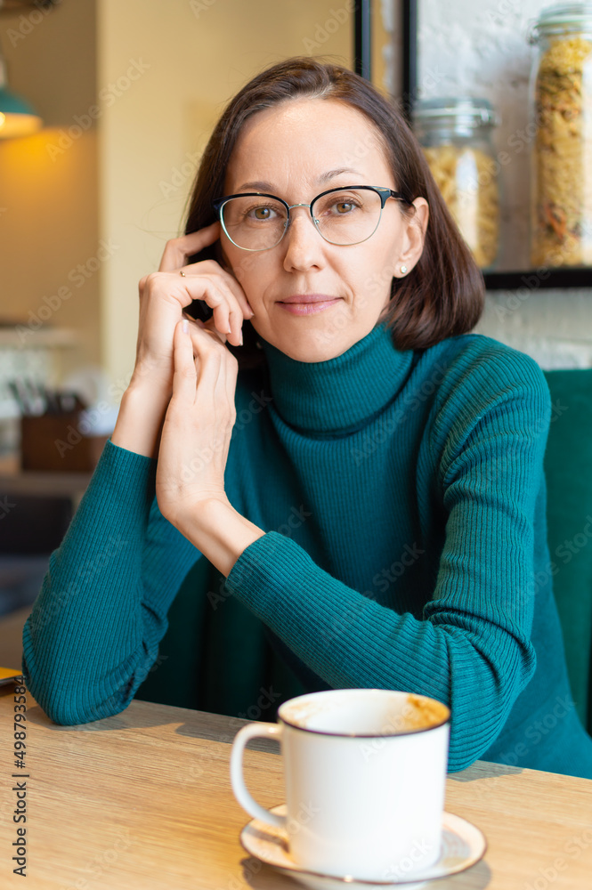 Portrait of beutiful woman relaxing in a coffee shop. Portrait of beutiful woman relaxing in a coffee shop.