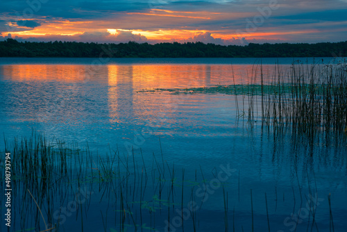 The nature of Belarus, a serene summer morning, a bright dawn on Lake Selyava photo
