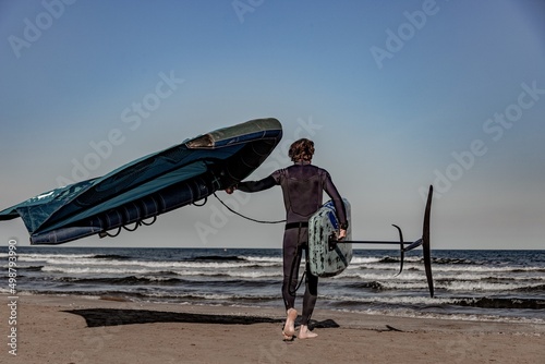 wing foil old kiter on the beach