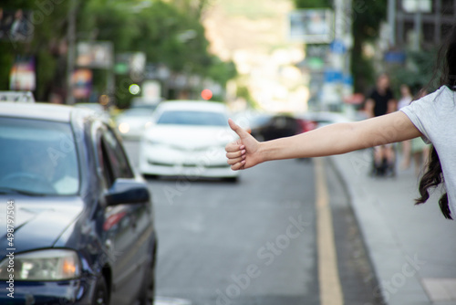 woman to stop a car in street