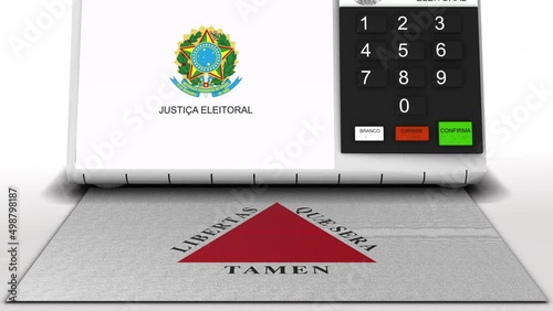 Electronic ballot box with the flag of the Brazilian state of Minas Gerais typing numbers for the position of state deputy in the elections photo