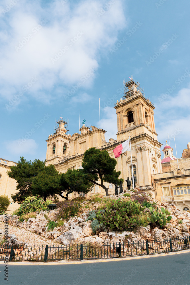 City of Malta, Cottonera, at a tourist spot with the Maltese flag.
