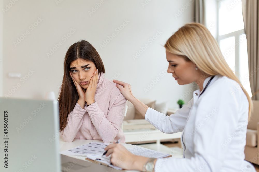 Patient receiving bad news, She is desperate and crying, Doctor support and comforting her patient with sympathy. Don't worry, this medical test is not so bad Patient receiving bad news, She is desperate and crying, Doctor support and comforting her patient with sympathy. Don't worry, this medical test is not so bad