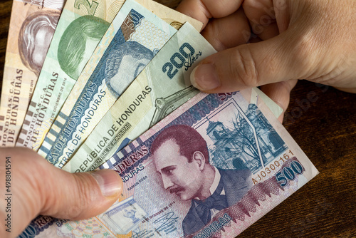 Honduran money hand to hand, Highest denominations, Financial concept photo