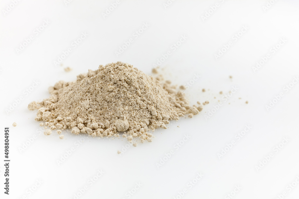Heap of ginger powder. Isolated on white. Copy space. Heap of ginger powder. Isolated on white. Copy space.