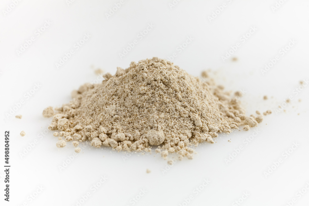 Wooden scoop of almond flour isolated on white background. Wooden scoop of almond flour isolated on white background.