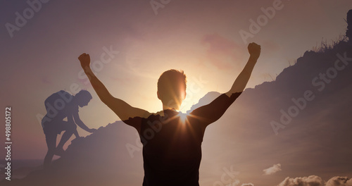 People power, sport, goal setting. Strong man climbing up mountain celebrating victory. Double exposure