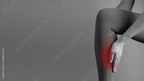 Banner with shin splints. Woman suffering from pain in leg with red spot closeup. Injury, medial tibial stress syndrome. Health care, orthopedic problems and medicine concept. Copy space. photo photo