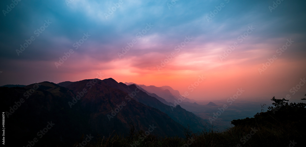 sunset over the mountains dramatic view of sunset sky