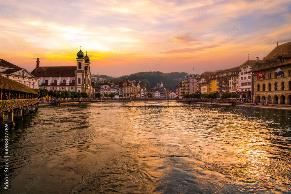 Sunset in historic city center of Lucerne with famous Chapel Bridge and lake Lucerne,  Switzerland