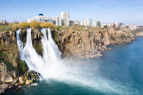 Waterfall Duden (Düden) falling into the Mediterranean sea.  Waterfall falling into sea. Waterfall stream. Aerial drone shooting. ANTALYA