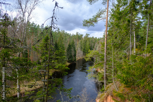 View to the river Salaca from high sandstone cliff in Skanaiskalns Nature park in April in Mazsalaca in Latvia.