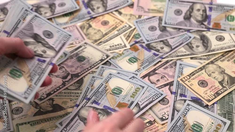 Hands closeup counting dollar paper currency, plenty many cash banknotes of USA.