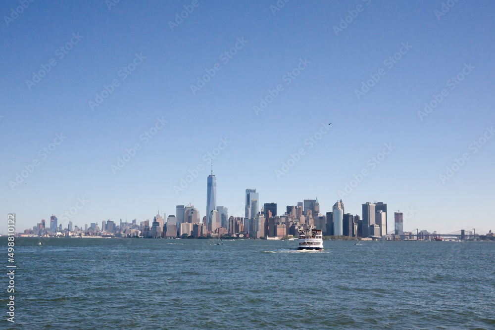 Manhattan skyline with upcoming ferry boat