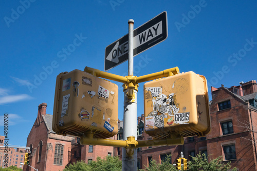 Urban sticker art on traffic lights in New York photo