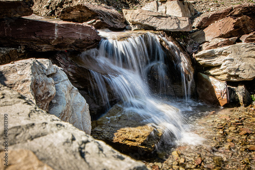 a small waterfall cascades through the rocks
