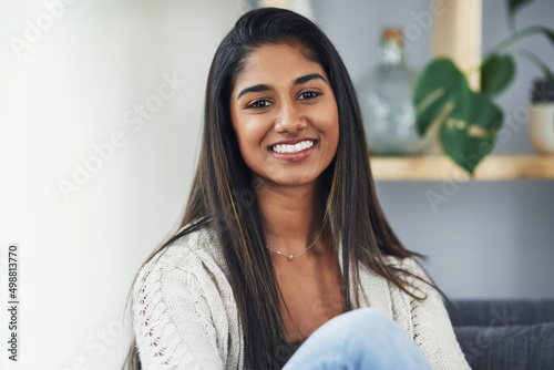 Shes loving her weekend alone. Cropped portrait of an attractive young woman relaxing on the couch at home. photo