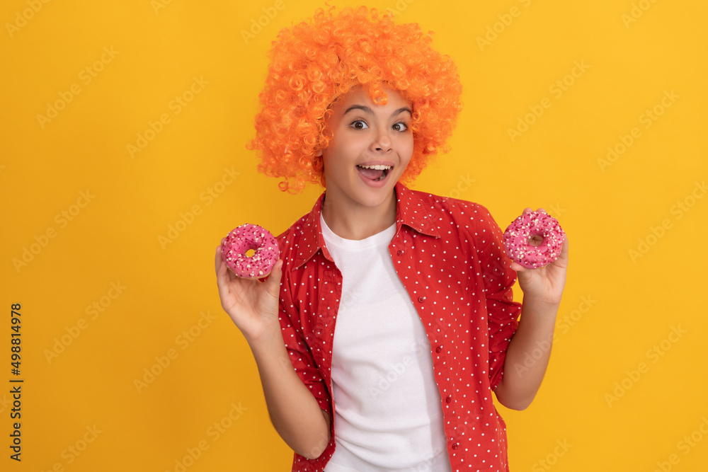 happy child in fancy orange wig hair hold sweet glazed donut, happiness happy child in fancy orange wig hair hold sweet glazed donut, happiness