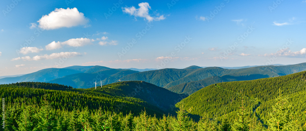 Mountain landscape in High Jesenik, view of the mountain range from the hiking trail to the Dlouhe Strane mountain peak, sunny day.