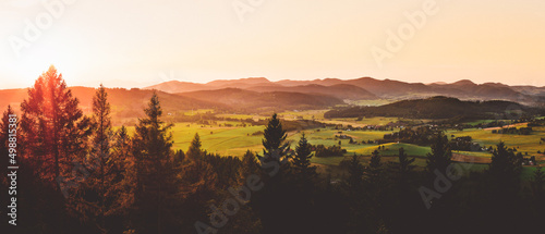 Mountain landscape at sunset, Walbrzyskie Sudetes, view from the observation tower on top of Wlodzicka Gora. photo