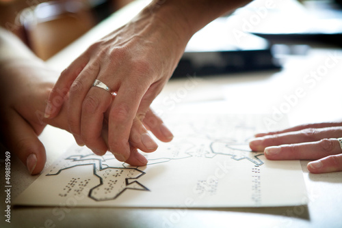 A blind or visually impaired pupil revises the maps in relief to pass.