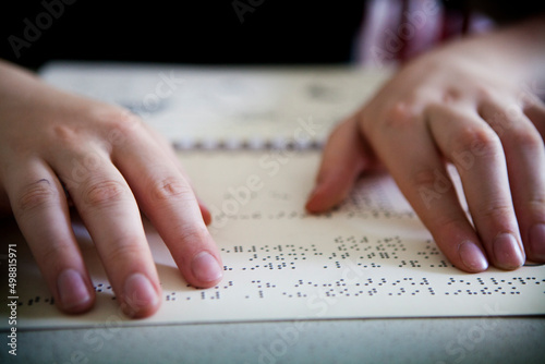 Fototapet A blind or visually impaired pupil revises the maps in relief to pass