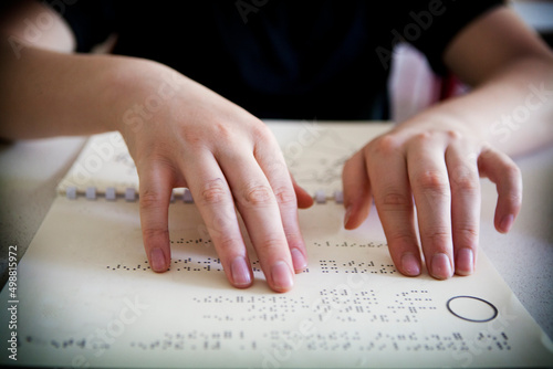 A blind or visually impaired pupil revises the maps in relief to pass.